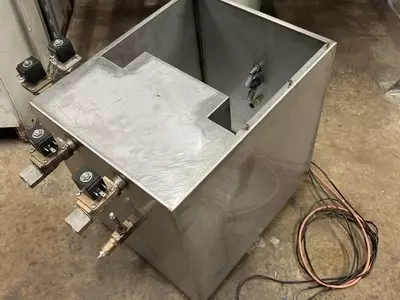 Custom-built stainless steel replacement tank assembled and ready for installation on a Nilfisk Delta Booster multi-pump pressure washer system.